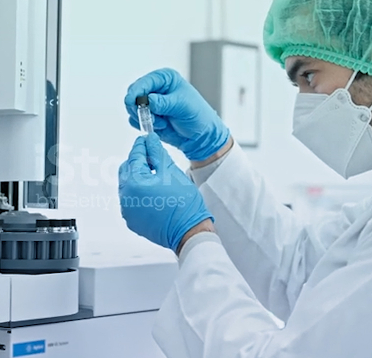 Laboratory technician holding a test tube in a lab setting