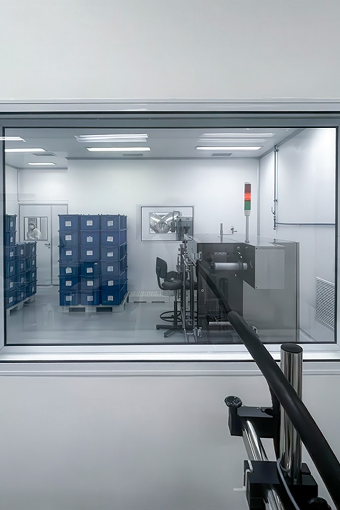 View of a cleanroom with blue storage bins and equipment