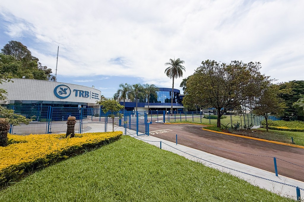 Exterior view of TRB building with landscaping and palm trees
